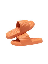 Two orange open toe flats slippers with textured footbed and quilted straps