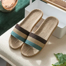 Open toe flats slippers in natural fibers with brown, tan, and blue stripes