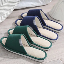 Green and navy open toe flats slippers with white soles and textured insoles