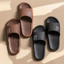 Four pairs of textured open toe flats slippers in brown and black