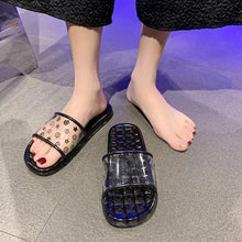 Black open toe flats slippers with transparent straps and subtle pattern