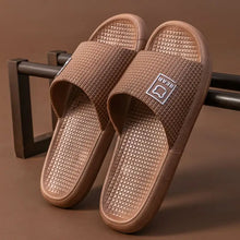 Pair of brown textured open toe flats slippers