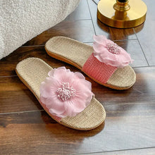 Pair of light pink floral linen open toe flats slippers