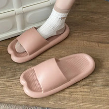 Pink open toe flats slippers with textured footbed, one with white sock