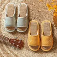 Open toe flats slippers in light blue and yellow with woven straw insoles for superior comfort