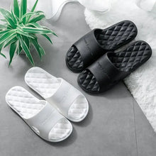 Two pairs of open toe flats slippers in solid colors with quilted footbeds