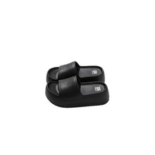 Black open toe platform slippers with textured straps and thick sole