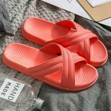 Vibrant coral open toe platform slippers with cross-straps and textured footbeds