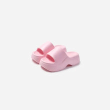 Pair of light pink open toe platform slippers with slide design