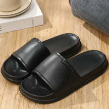 Black open-toe platform slippers with textured footbed