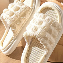 Cream-colored textured open toe platform slippers