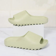 Light green open toe platform slippers with textured soles
