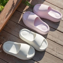 Two pairs of pink and white open toe platform slippers with thick soles