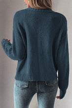Dark green textured knit cardigan with long sleeves and lace details