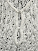 Openwork long sleeve knit dress with white lace detailing and central knot