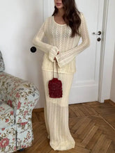 Cream-colored herringbone openwork long sleeve knit top and skirt set