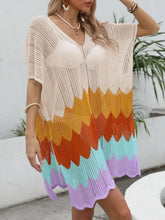 Woman in openwork V-neck half sleeve crochet tunic in beige, orange, turquoise, purple