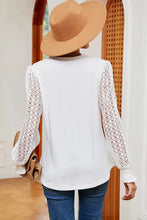 White long sleeve V-neck T-shirt with lace sleeves and tan hat