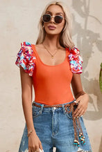 Womans orange bodysuit with floral ruffle sleeves
