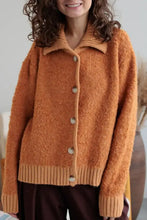 Orange fuzzy long sleeve cardigan with collared neck button front