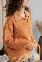 Orange fuzzy long sleeve cardigan with collared neck button front