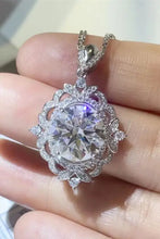 Ornate sterling silver necklace with round brilliant diamond pendant
