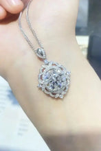 Ornate sterling silver necklace with round brilliant diamond pendant