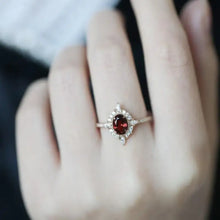 Oval cut ruby and diamond halo ring in sterling silver with matching box