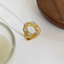 Oval statement ring with mother-of-pearl cabochons in 18k gold-plated steel