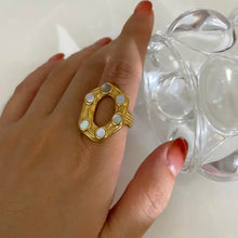 Oval statement ring with mother-of-pearl cabochons in 18k gold-plated steel