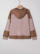 A cozy beige and taupe oversize waffle patchwork casual hoodie with ribbed knit and exposed seam accents