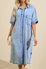 Light blue oversized denim shirt dress with short sleeves and front button closure in denim material