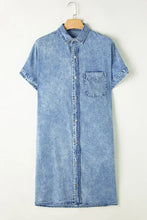Light blue oversized denim shirt dress with short sleeves button-down front and single chest pocket