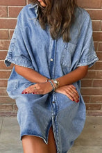 Oversized button down medium-wash denim shirt dress with short sleeves and loose-fitting design for casual wear