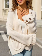 Übergroßer Strickcardigan in Erdtönen, cremefarben, mit Rippstruktur, legerer Schnitt und Knopfmanschetten