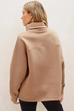 Beige oversized long sleeve sweatshirt with drawstring turtleneck and pocket