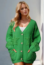 Oversized green textured cotton cardigan with star, pom-pom, pockets, buttons