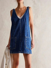 Blue denim oversized v-neck denim tank dress with two front pockets made of machine wash fabric