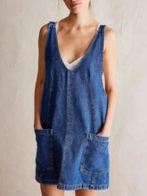 Oversized v-neck denim tank dress in blue with front pockets made of machine wash friendly denim fabric