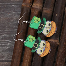 Pair of owl acrylic dangle earrings in green leprechaun hats with shamrocks