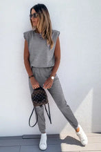 Gray Louis Vuitton monogram mini backpack with padded shoulder straps paired with joggers lounge set