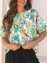 Paisley floral printed puff sleeve blouse with colorful teal orange and green paisley pattern on white background