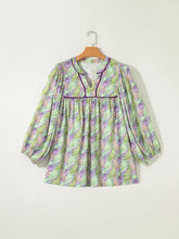 Paisley print half puff sleeve blouse in light green and purple with v-neckline and gathered waist design