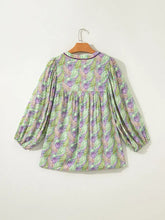 A soft paisley print half blouse in green and purple with gathered waist and half puff sleeve for a flattering look