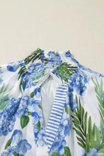 White neck short sleeve blouse with vibrant blue hydrangea striped patchwork and smocked elasticated neckline
