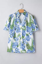 White short sleeve blouse with blue hydrangea and green palm leaf print featuring ruffled sleeves and striped patchwork neck short sleeve design