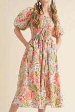 Peach floral smocked dress with puff sleeves and pockets