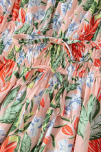 Pastel floral print summer dress with ruffled hem, drawstring waist, and puff sleeve options on pink background