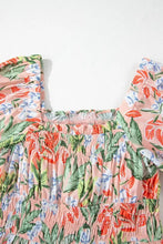 Pastel floral print off-shoulder blouse with ruffled hem in pink and green hues