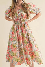 Pastel floral print summer dress with puff sleeves and smocked waistband in peach and green hues